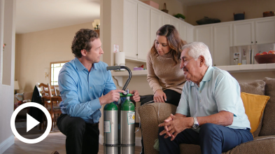 special medical equipment man demonstrating medical equipment to 2 people
